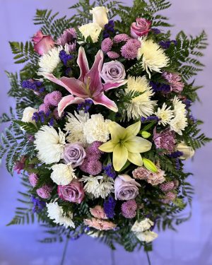 White, purple and pink funeral spray