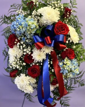 White, red and blue funeral spray