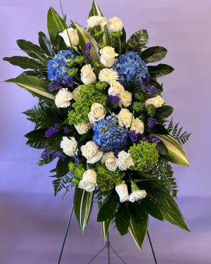 Blue, green and White funeral spray